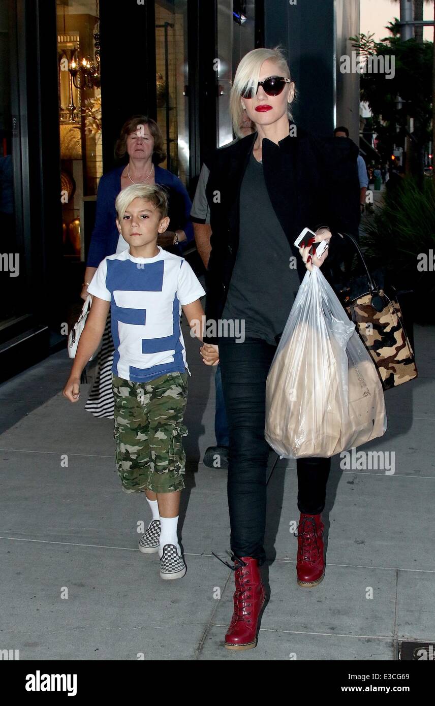 Gwen Stefani walking in Dr. Martens cherry red boots and carrying a large  see through shopping bag, in Beverly Drive with son Kingston Rossdale  Where: Los Angeles, CA, United States When: 29