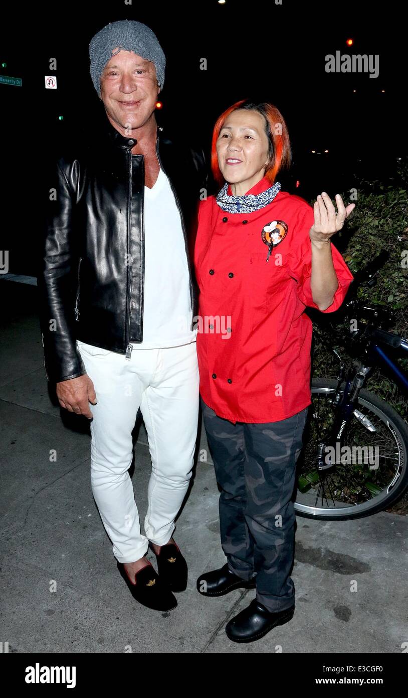 Mike Rourke Hat Micky Rourke wearing white trousers, black leather jacket and a tatty ...