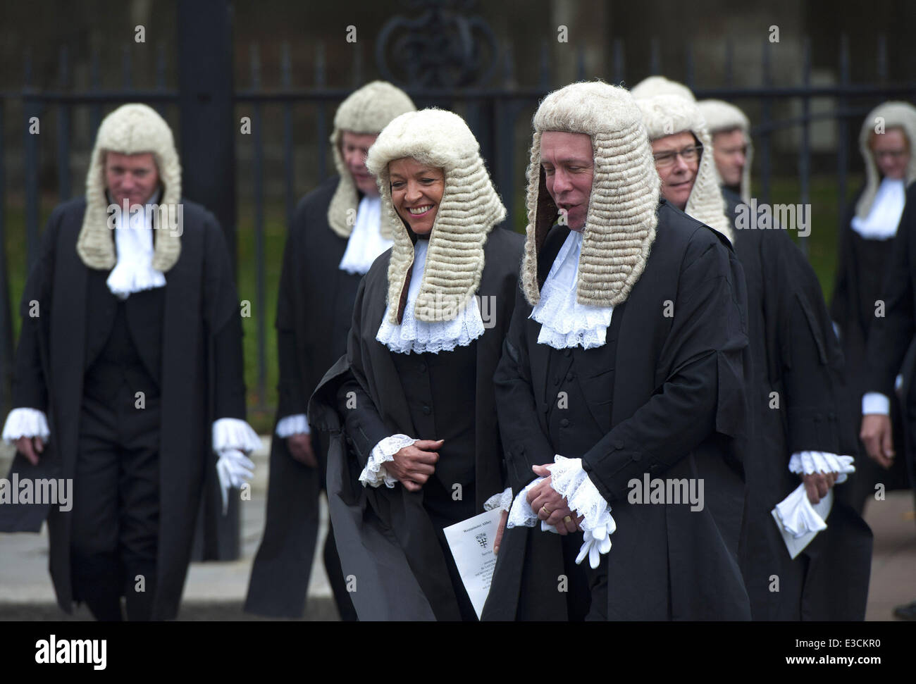 Judges walk towards the Houses of Parliament after attending their