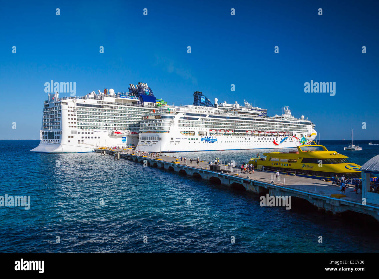 The cruise ships Norwegian Dawn and the Norwegian Epic docked at the port of Cozumel, Mexico, Caribean. Stock Photo