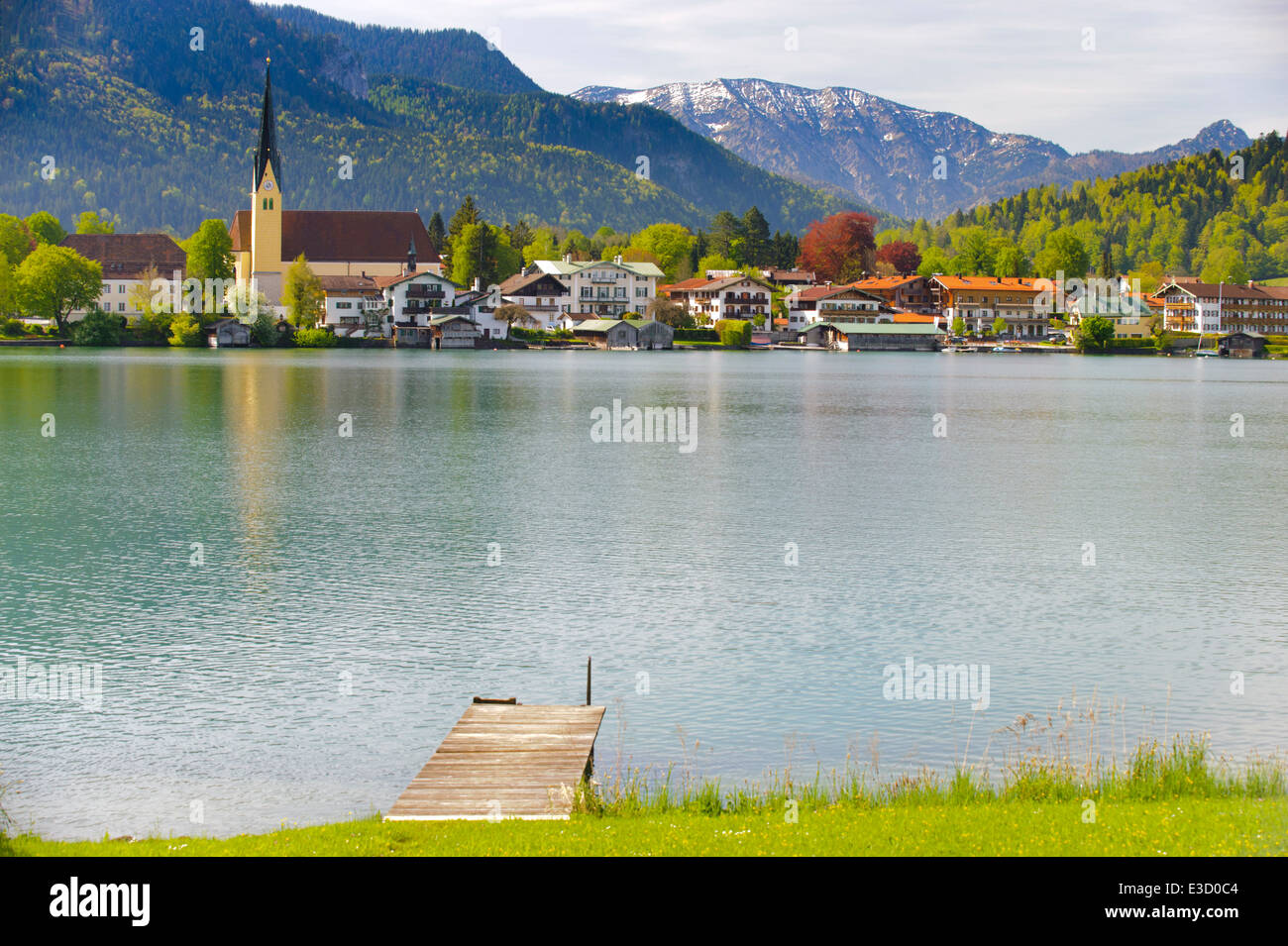 panorama landscape of lake Tegernsee in Bavaria at city Rottach-Egern and its church Stock Photo