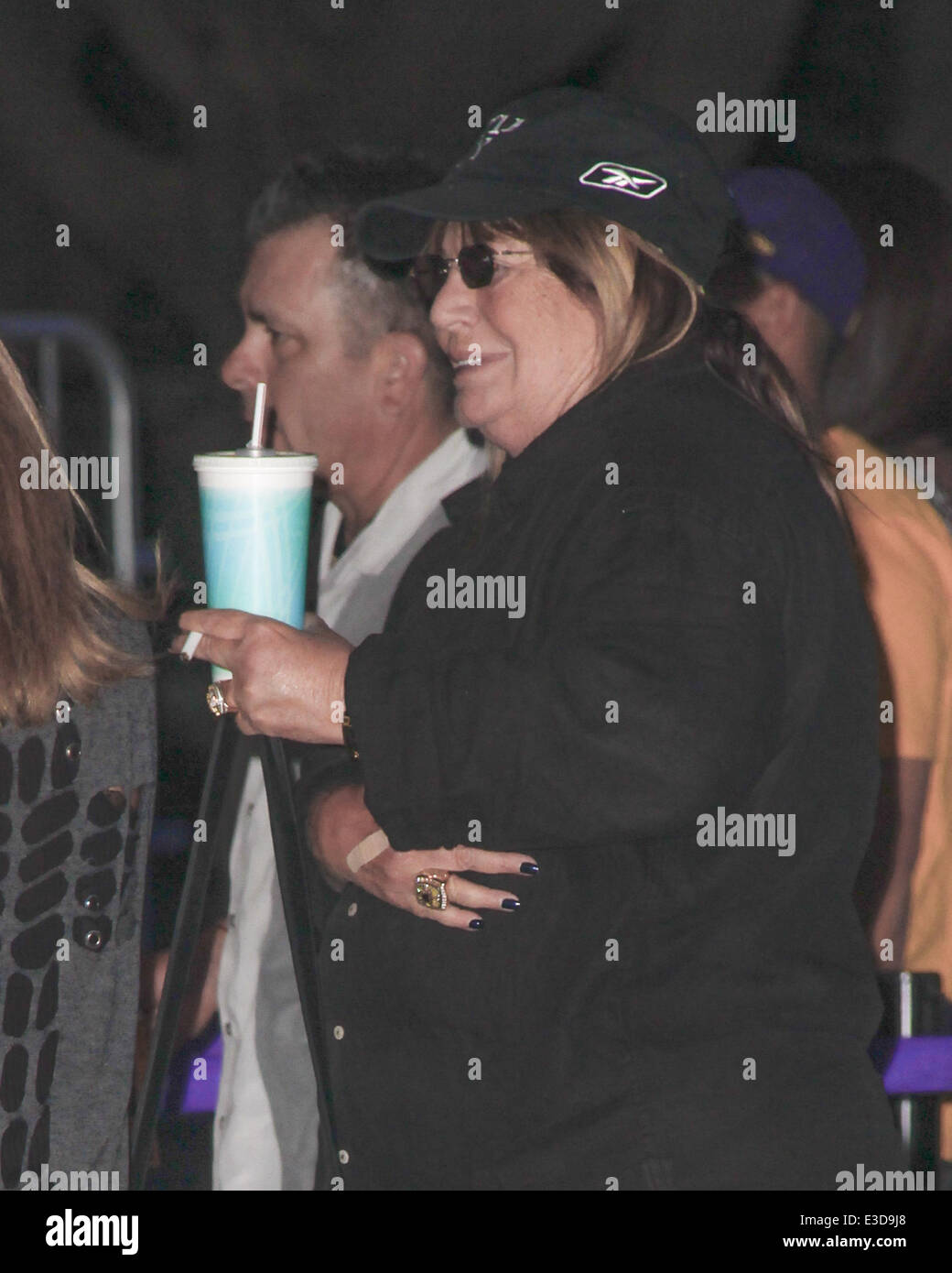 Penny Marshall Arriving at a Lakers Game at the Staples Center holding a  cigarette. Featuring: Penny Marshall Where: Downtown Los Angeles, CA,  United States When: 07 Oct 2013 Stock Photo