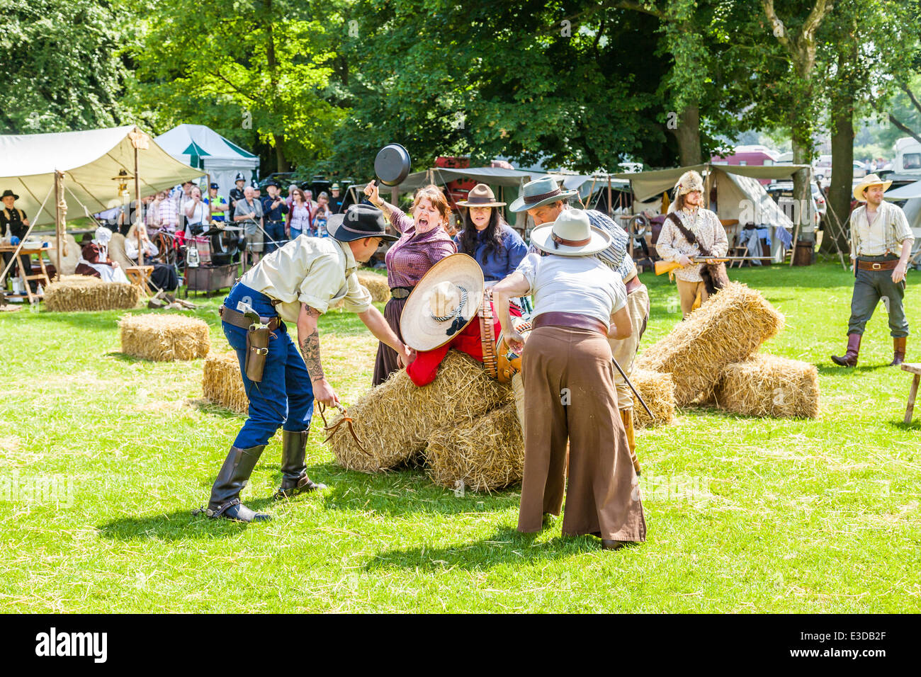 Leek, Staffordshire, England. 22nd June 2014, A Country and Western Weekend. A Lynch mob threaten to hang Villain Cowboy. Stock Photo