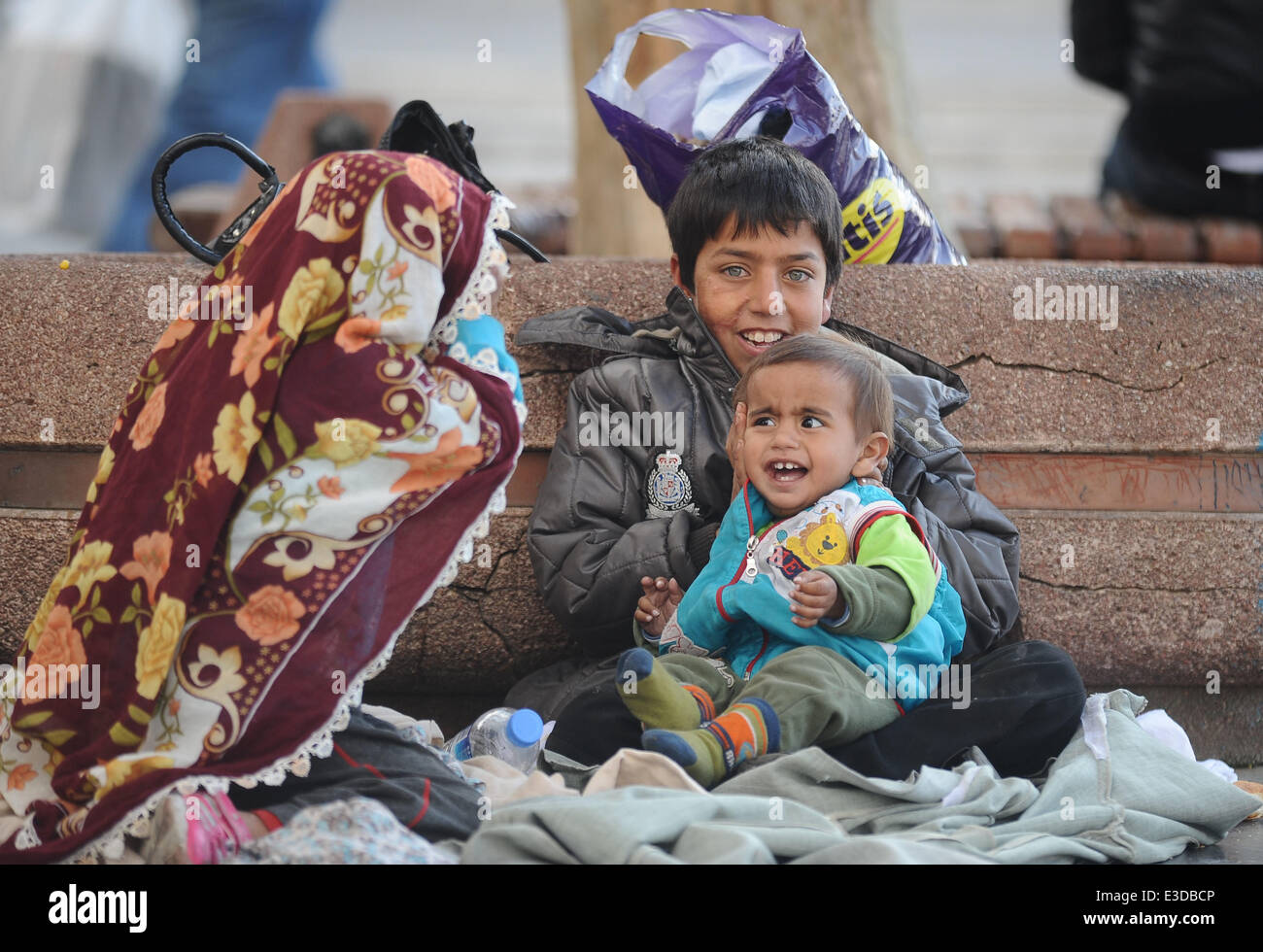 Syrian citizens have fled from Aleppo amid war to Turkey, many with small children, in search of a safe haven. According to reports, hundreds are now living in the parks and streets, mainly in the Kumkapı, Fatih and Sirinevler districts of the city, where they have been spotted begging for food for their families  Where: Istanbul, Turkey When: 07 Oct 2013  **** Stock Photo