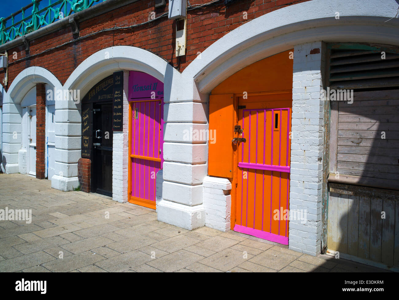 Colourful arches beneath King's Road, near the pier, Brighton, Sussex, UK Stock Photo