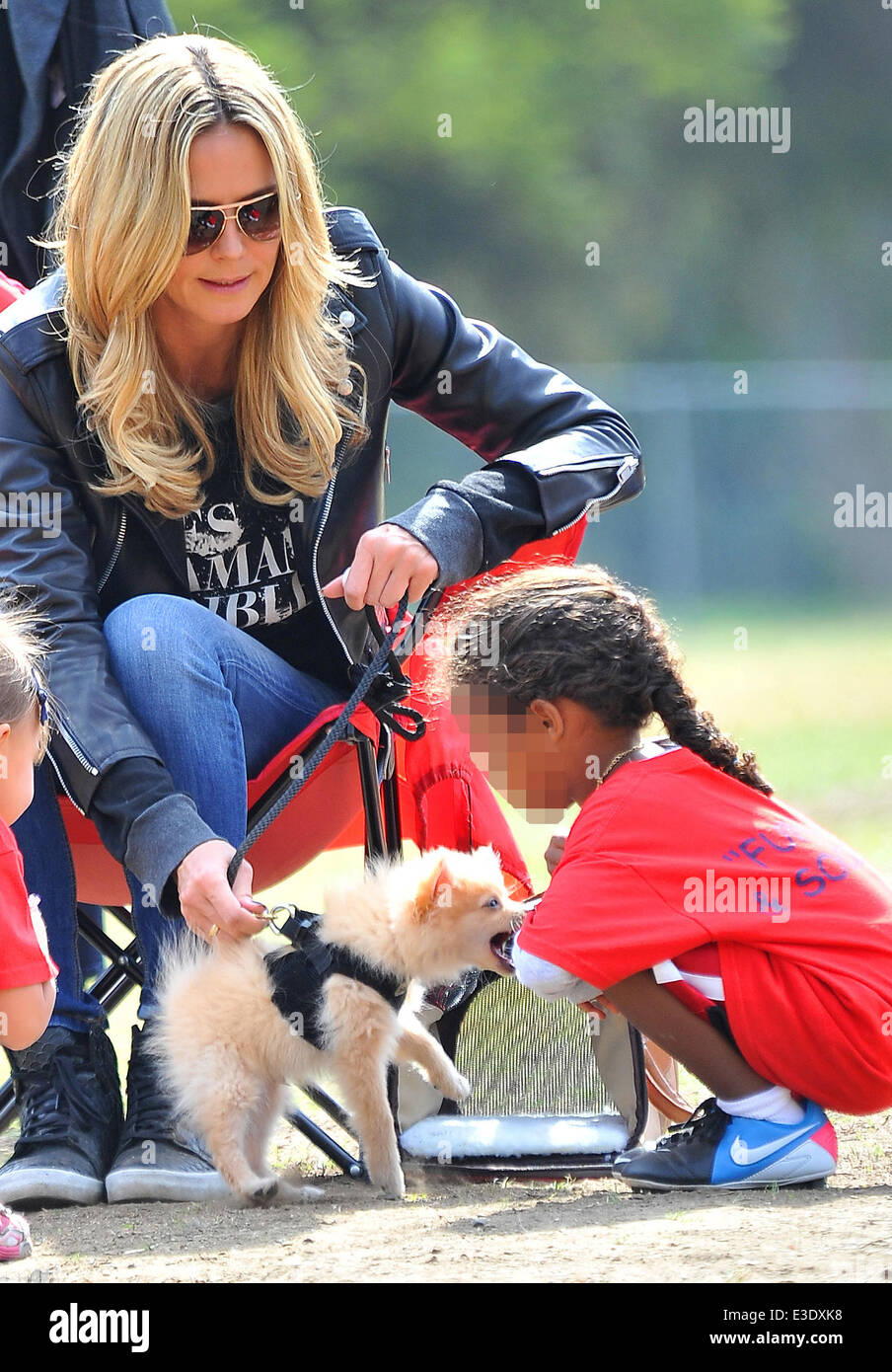 Heidi Klum watches her children playing soccer while looking after