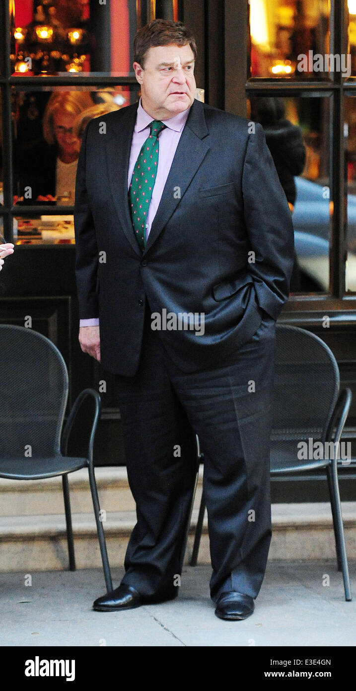 American actor John Goodman smokes a cigarette outside a hotel in London  Featuring: John Goodman Where: London, United Kingdom When: 16 Oct 2013  Stock Photo