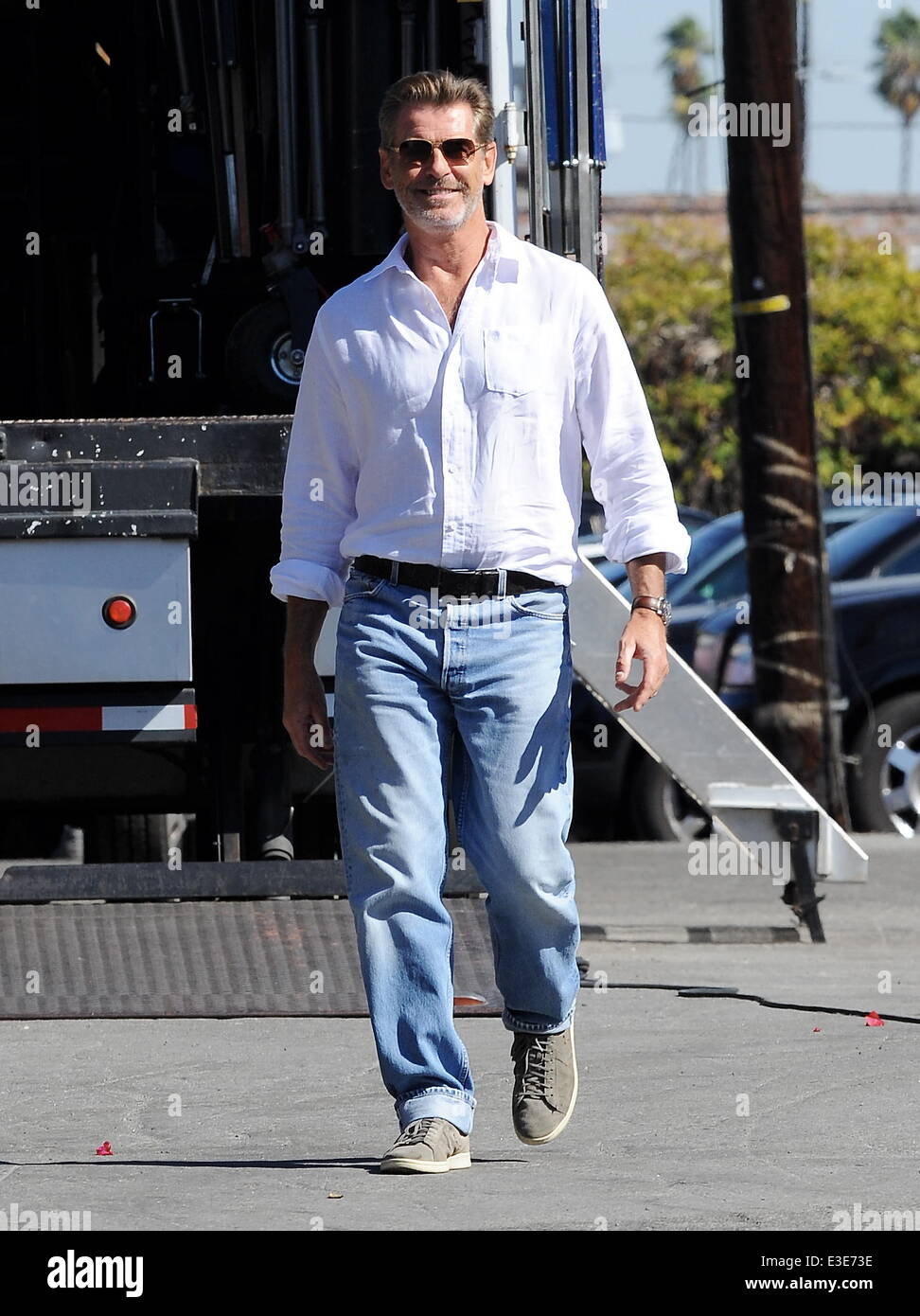 Pierce Brosnan is all smiles while walking around on the set of his new movie "How To Make Love Like An Englishman" filming in Dowtown Los Angeles  Featuring: Pierce Brosnan Where: Los Angeles, CA, United States When: 16 Oct 2013 Stock Photo