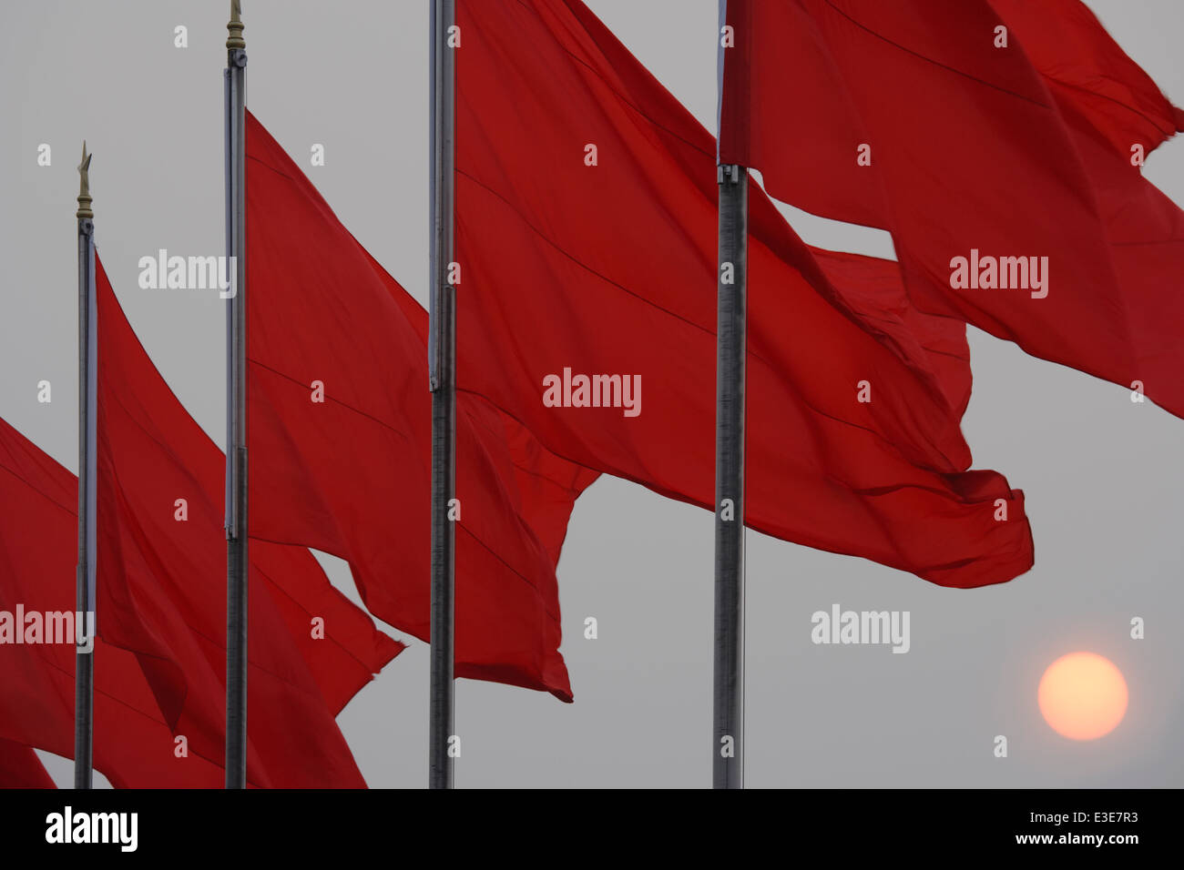 Red flags at sunset over Tiananmen Square, Beijing, China. Stock Photo