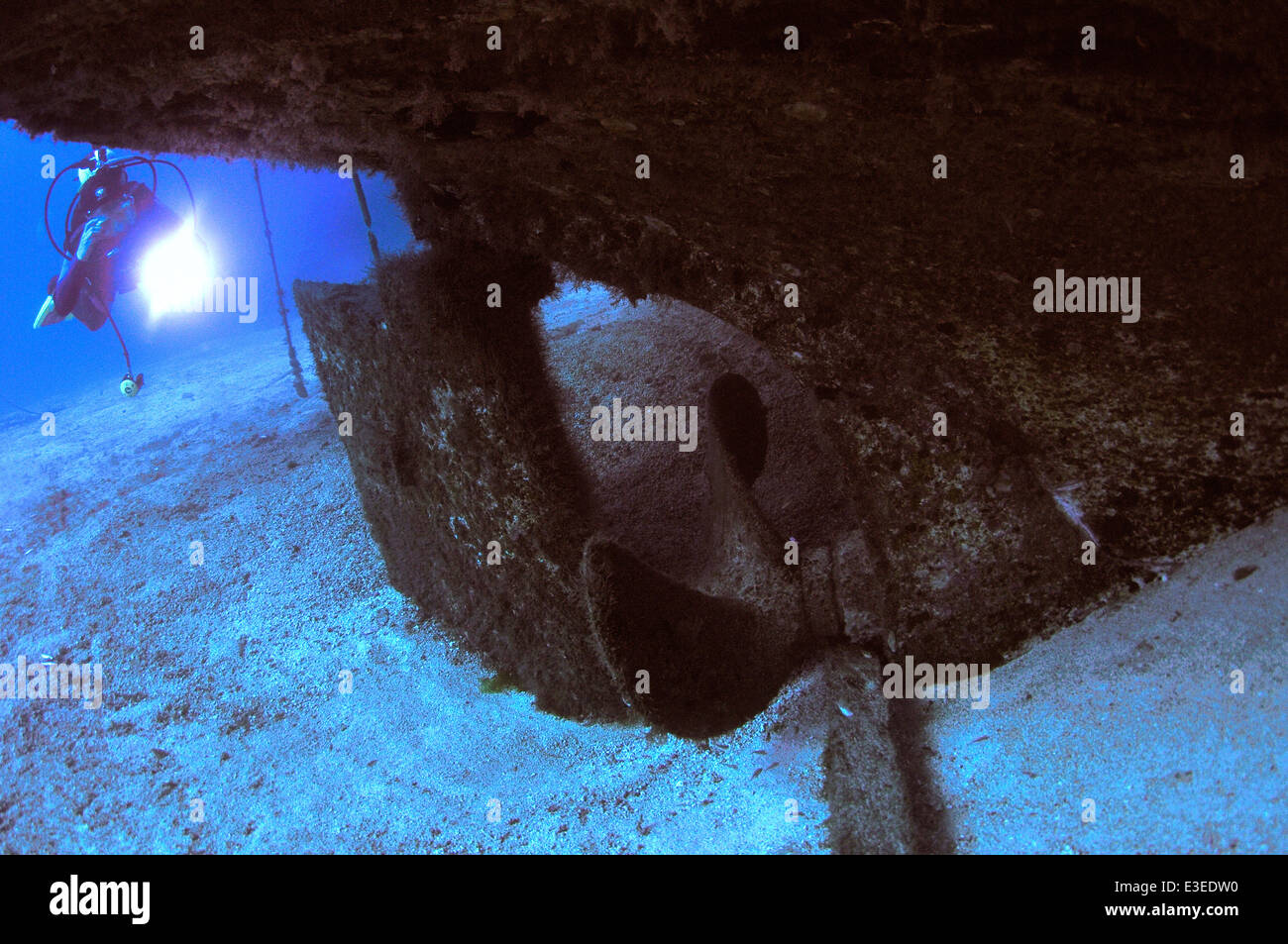 Scuba diver underwater approaching the El Meridian wreck prop and rudder south Tenerife, Canary Islands Stock Photo