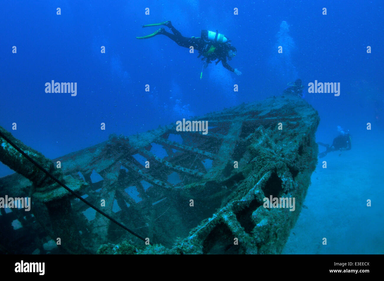Scuba divers underwater by the bow of El Meridian wreck south Tenerife, Canary Islands Stock Photo