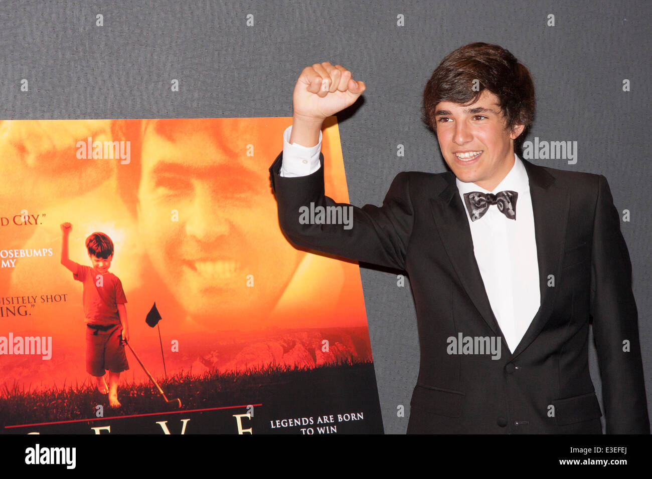 London, UK. 23rd June, 2014. Jose Luis Gutierrez Real who stars as a young Seve mimmics the film's poster at the premiere of the film Seve, a biopic of the life of the legendary Spanish golfer Seve Ballesteros. Stock Photo