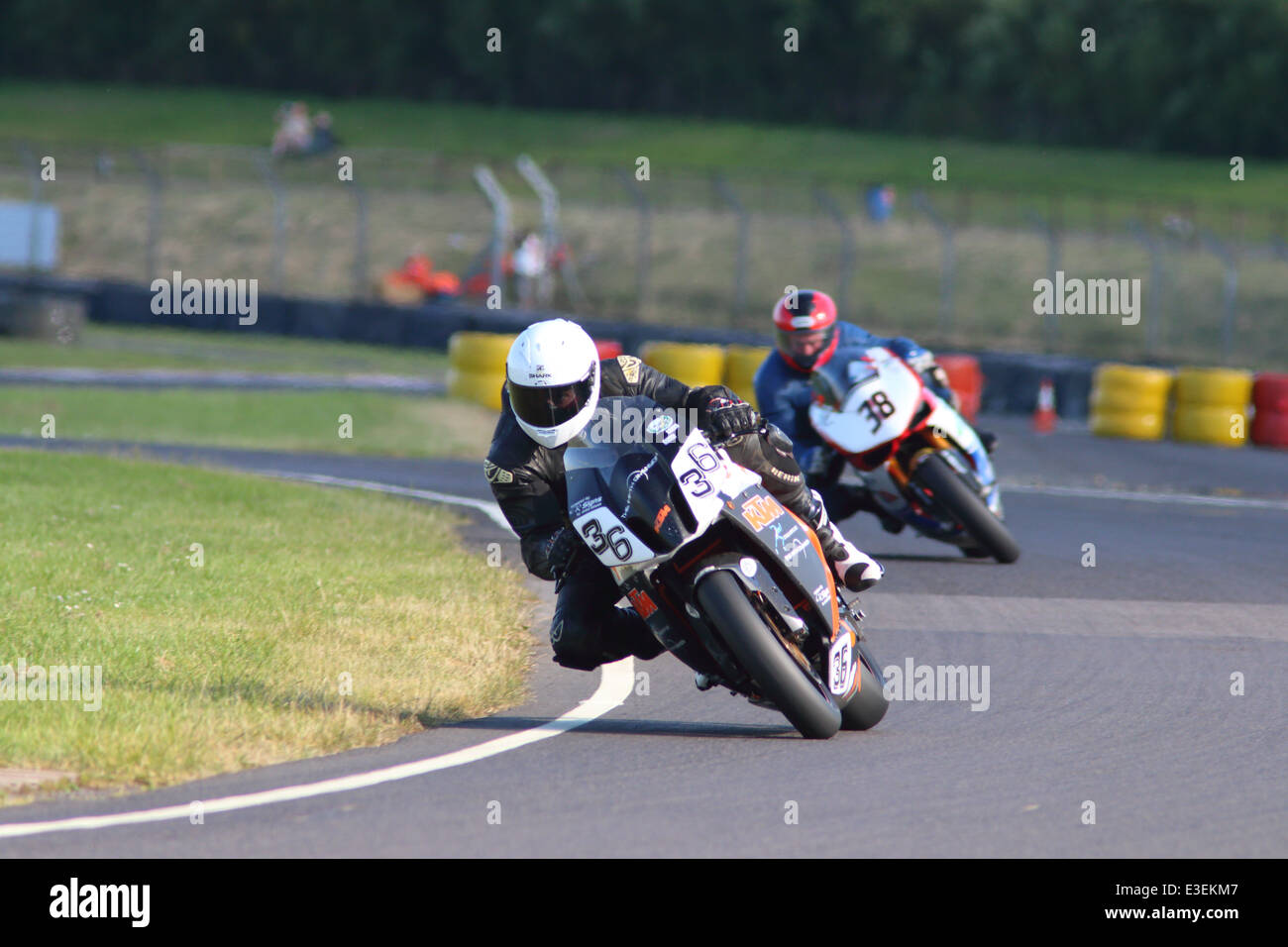 Motorcycles racing around Castle Combe Circuit at their Grand National