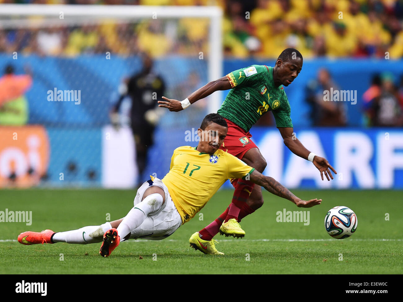 Brasilia, Brazil. 23rd June, 2014. Cameroon's Eyong Enoh (R) and Luiz Gustavo of Brazil vie for the ball during the FIFA World Cup 2014 group A preliminary round match between Cameroon and Brazil at the Estadio Nacional in Brasilia, Brazil, 23 June 2014. Photo: Marius Becker/dpa/Alamy Live News Stock Photo