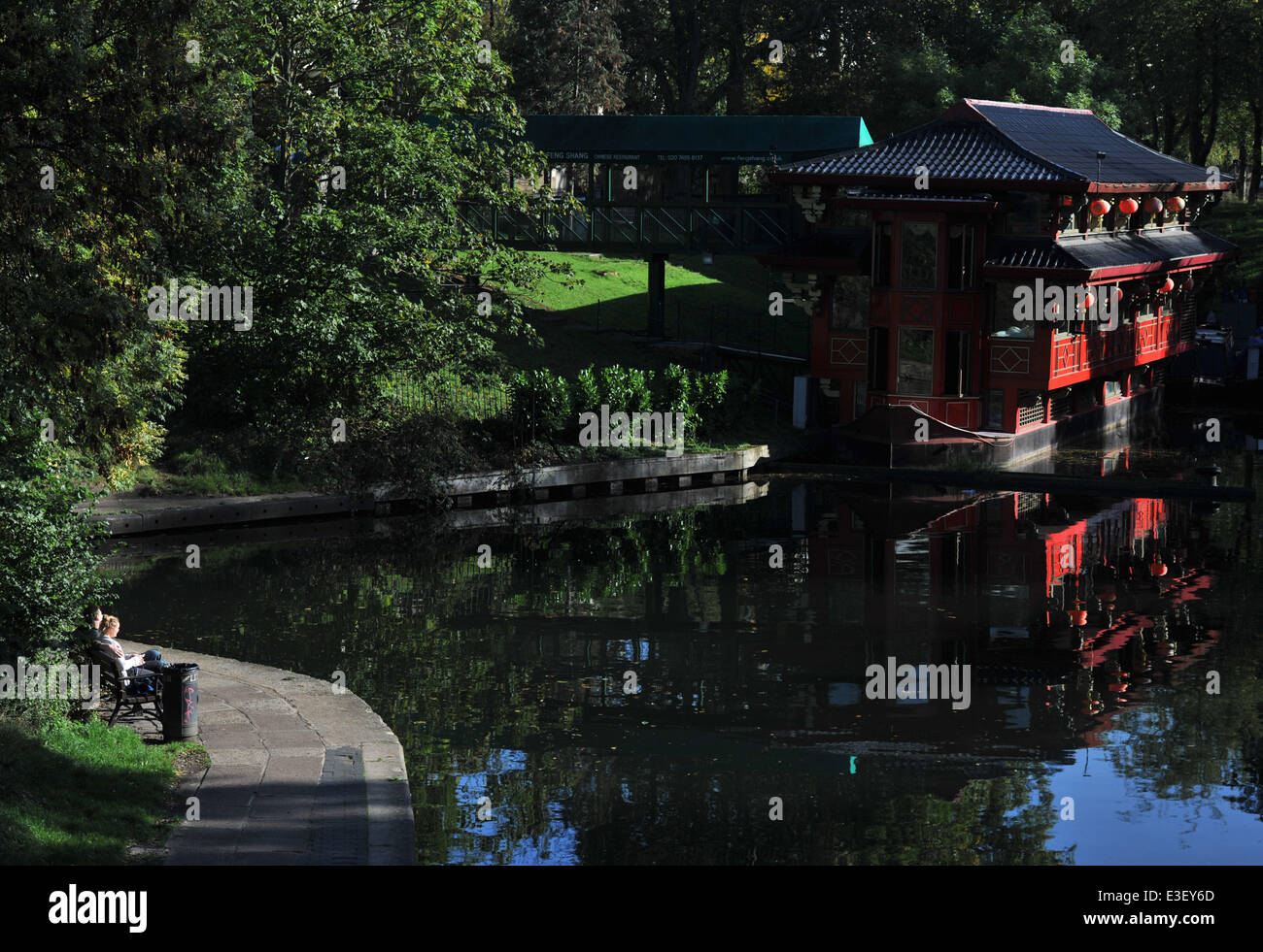 People enjoy the sunny autumn weather in London's Regent's Park and