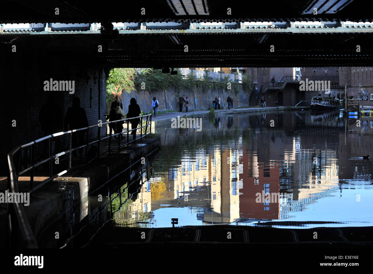 People enjoy the sunny autumn weather in London's Regent's Park and