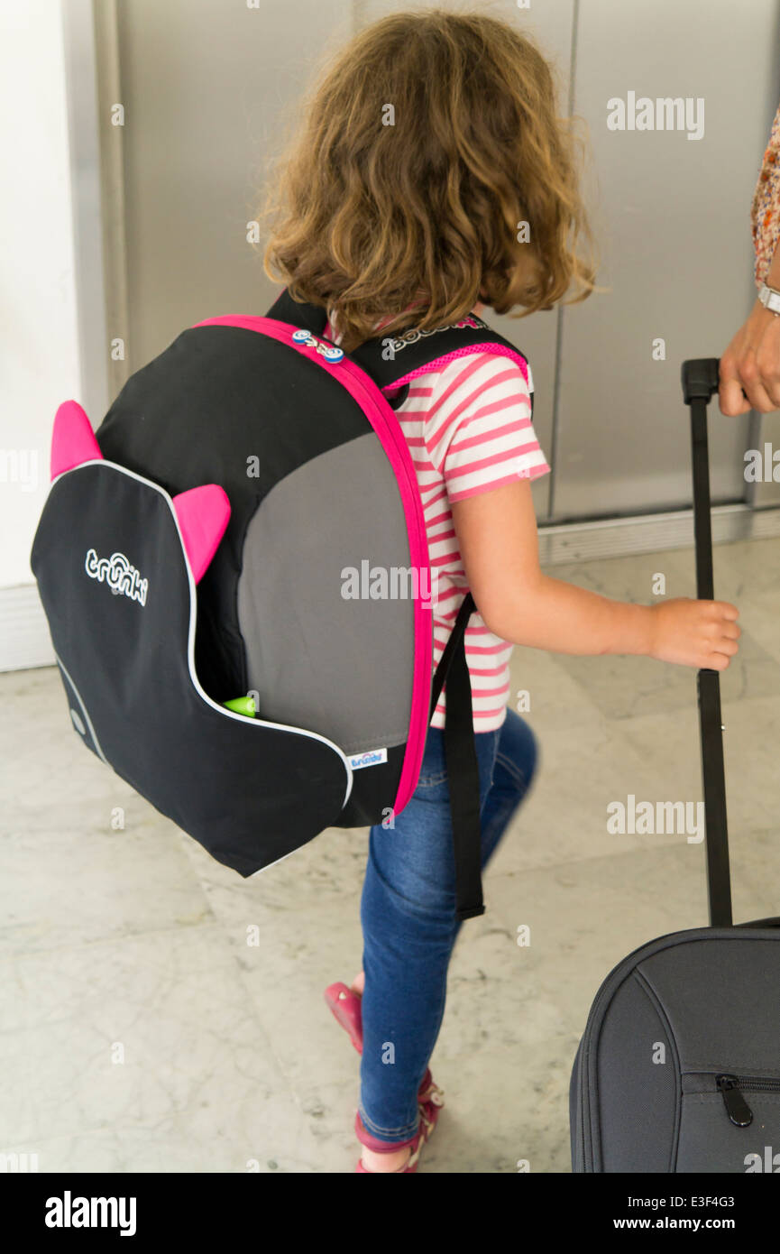 Trunki BoostApak worn by young child travelling Stock Photo - Alamy