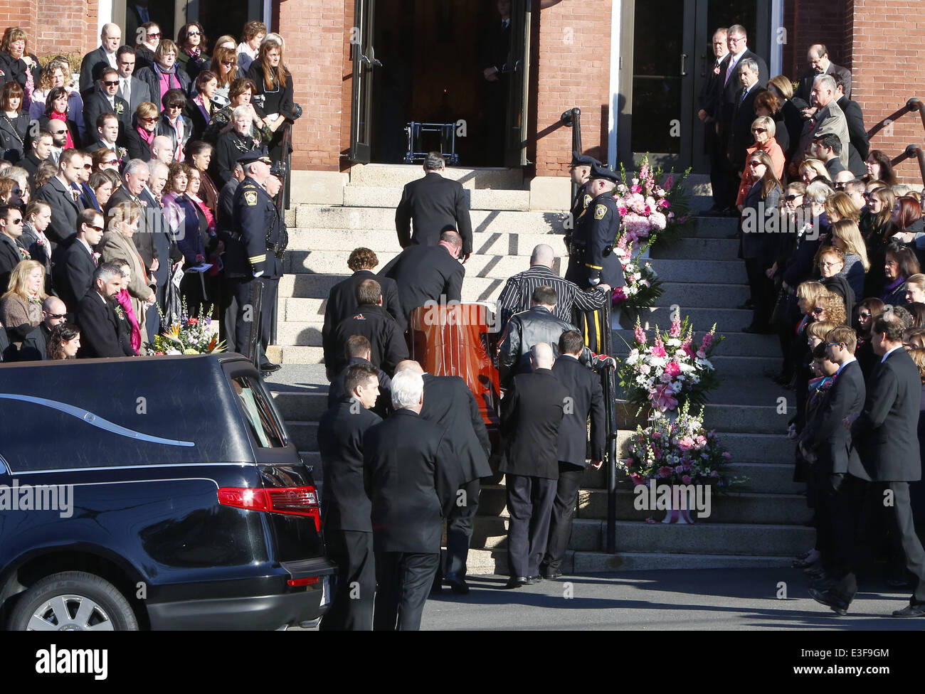 Pallbearers carry the casket of Colleen Ritzer, a 24yearold math