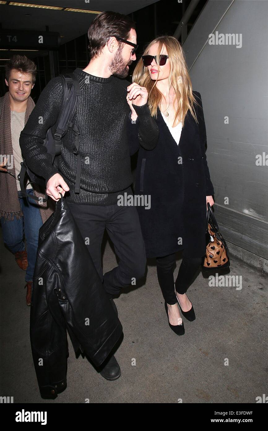 Kate Bosworth and husband Michael Polish hold hands as they arrive at