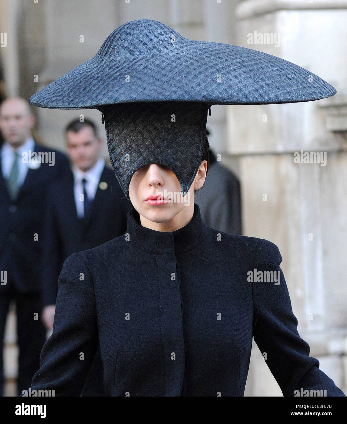 Lady Gaga dressed all in black, and wearing an accessory covering half of her face, leaves her hotel  Featuring: Lady Gaga Where: London, United Kingdom When: 30 Oct 2013 Stock Photo