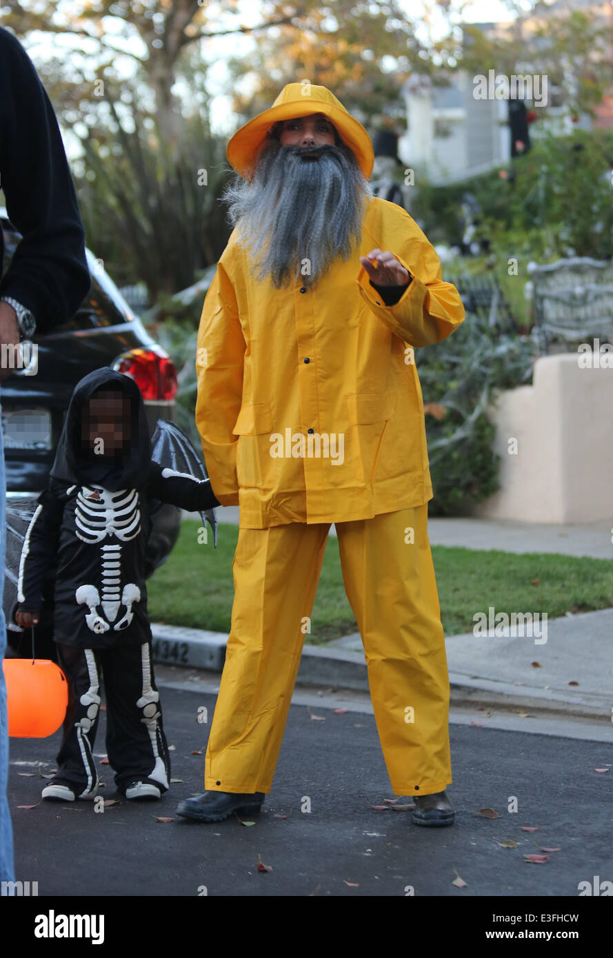 Sandra Bullock dressed as a fisherman, complete with grey beard and bright  yellow sowester, takes her son Louis out for trick or treating for  Halloween in Toluca Lake Featuring: Sandra Bullock,Louis Bullock