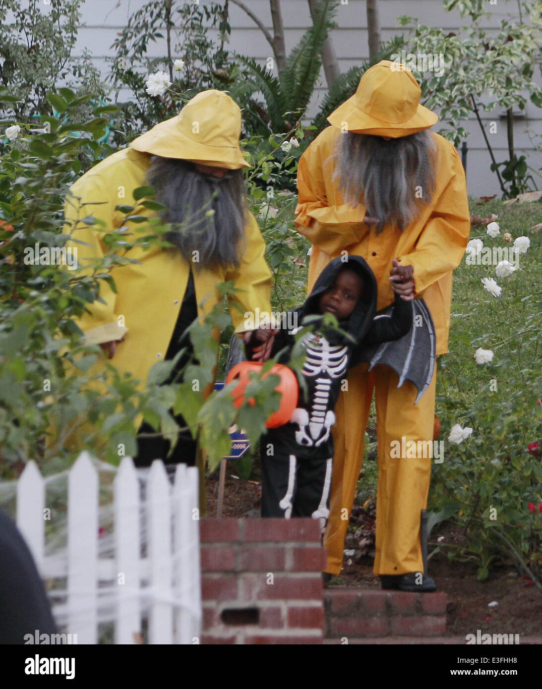 Sandra Bullock and Melissa Mccarthy dressed as a fisherman, complete