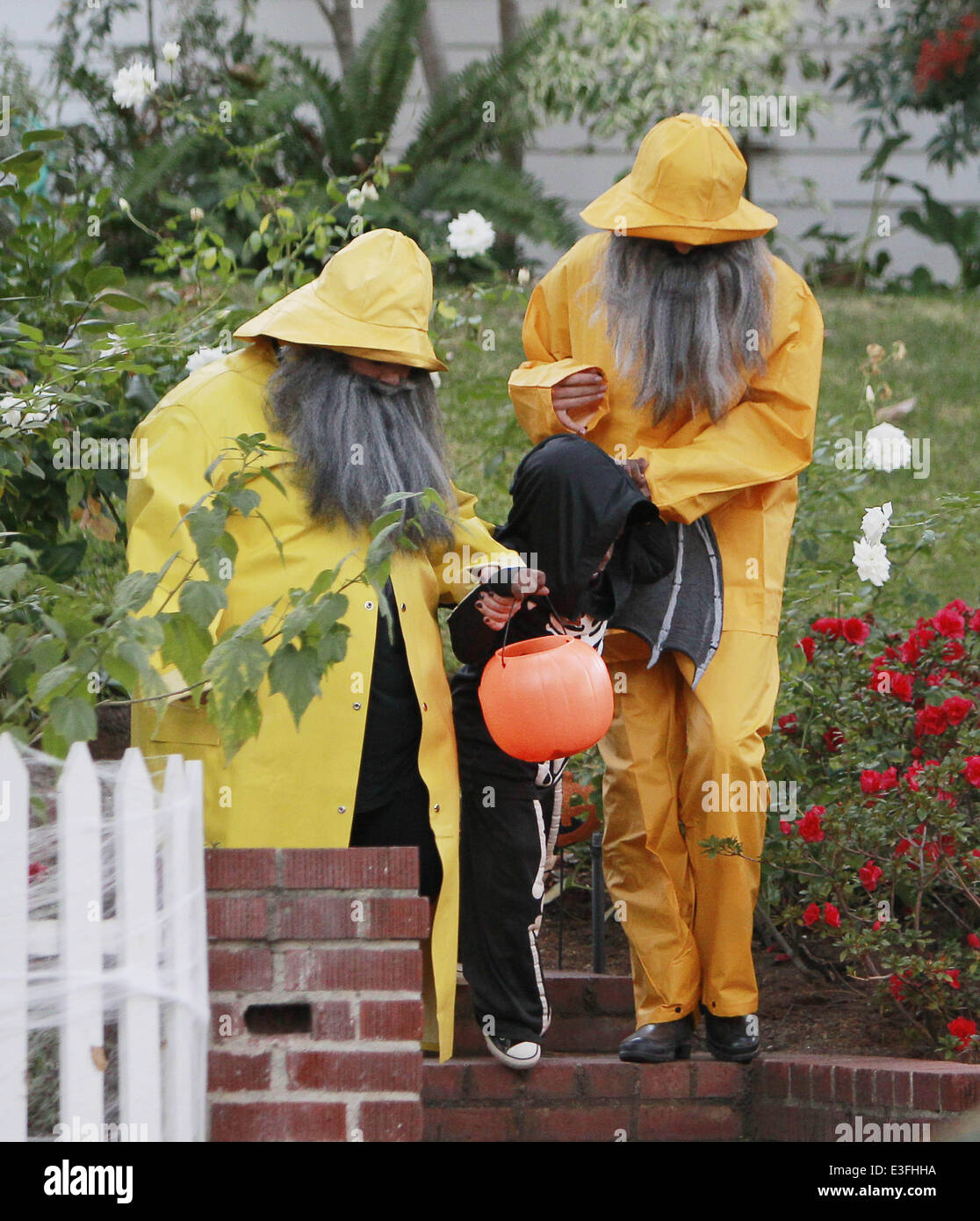 Sandra Bullock and Melissa Mccarthy dressed as a fisherman, complete