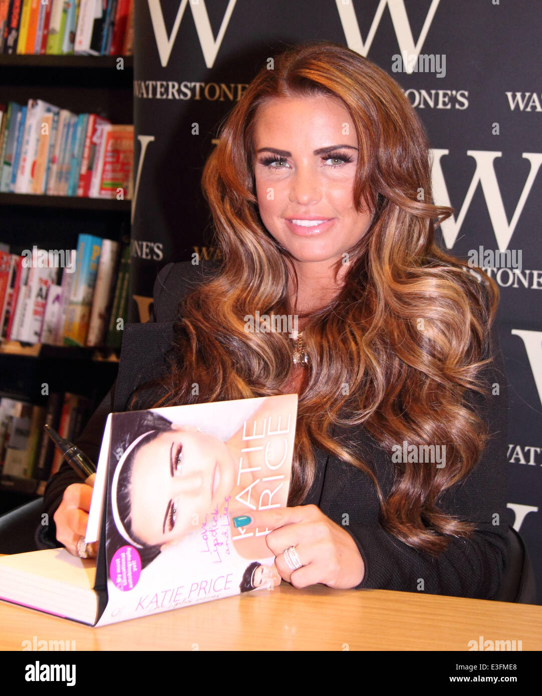 Katie Price signs copies of her new autobiography, 'Love, Lipstick and ...