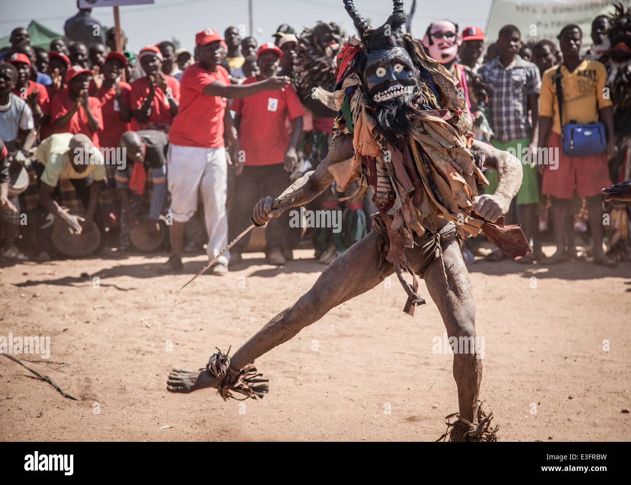 Maputo. 12th June, 2014. Photo taken on June 12, 2014 shows Nyau dancer perform in the northwestern province of Tete, Mozambique. Nyau masks are worn by only male members of the society and represent male knowledge, and are understood to be spirits of the dead during performance. Nyau is an ethnic society in western Mozambique, central and southern Malawi, eastern Zambia, and areas where Malawians migrated in Zimbabwe. © Mauro Vombe/Xinhua/Alamy Live News Stock Photo