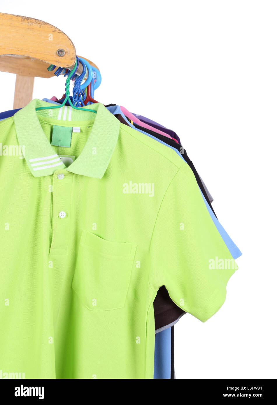Hanging Polo shirt isolted on white background Stock Photo