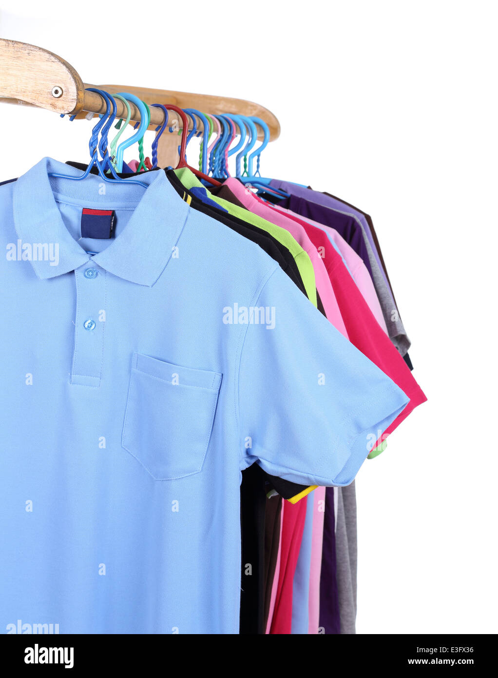 Hanging Polo shirt isolted on white background Stock Photo