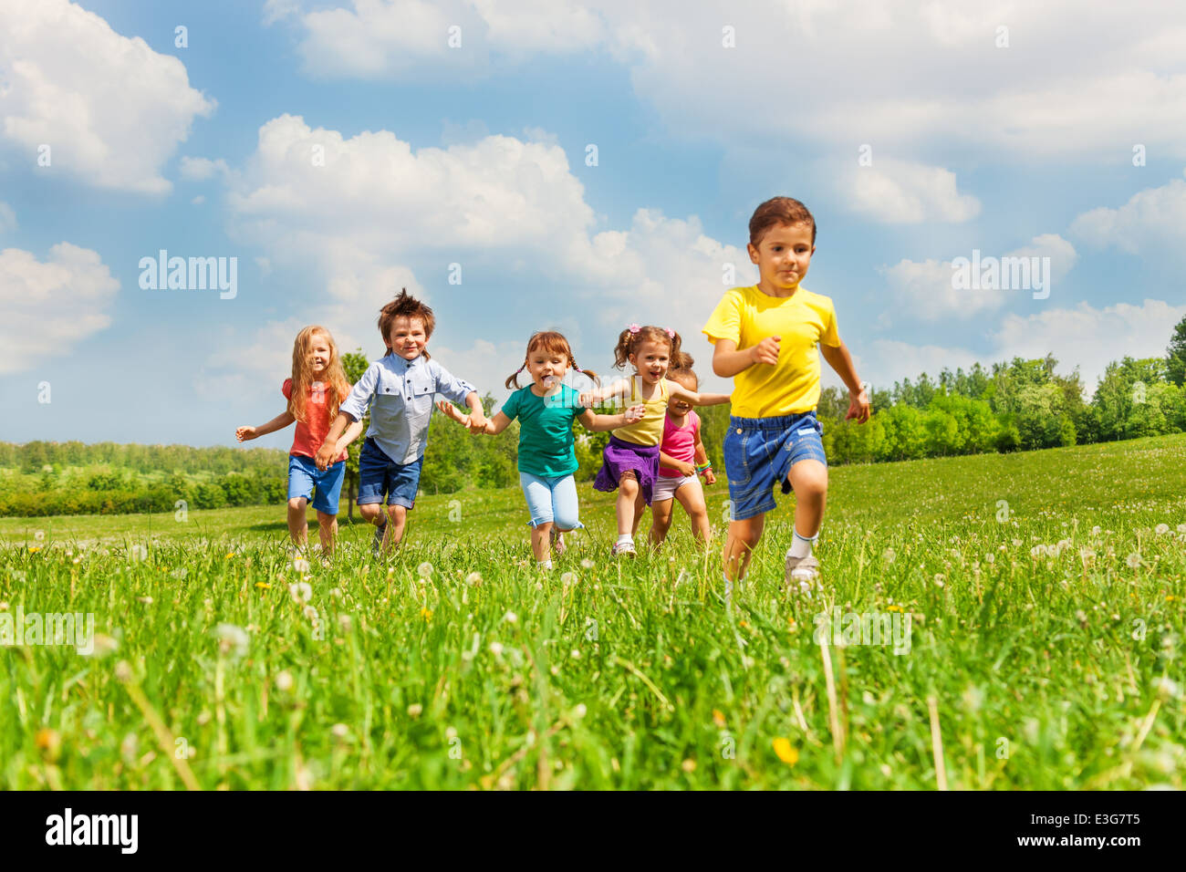 Group happy little kids running hi-res stock photography and images - Alamy