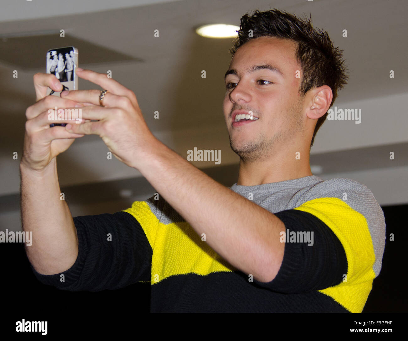Tom Daley signs copies of his official 2014 calendar at HMV Oxford Circus  Featuring: Tom Daley Where: London, United Kingdom When: 10 Nov 2013 Stock Photo