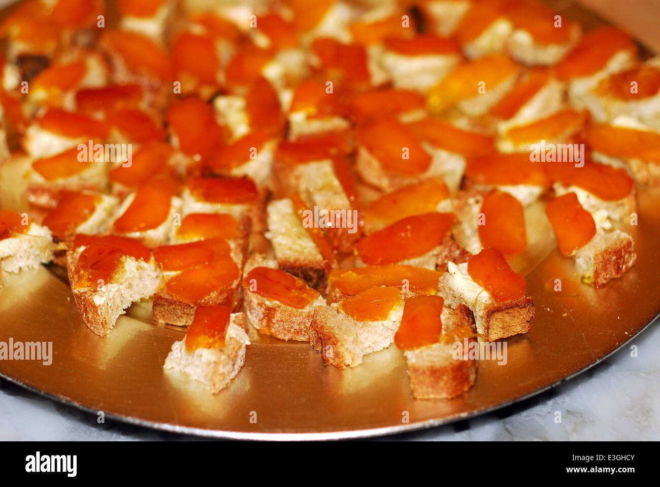 A plate of sliced botargo on buttered bread as appetizers Stock Photo