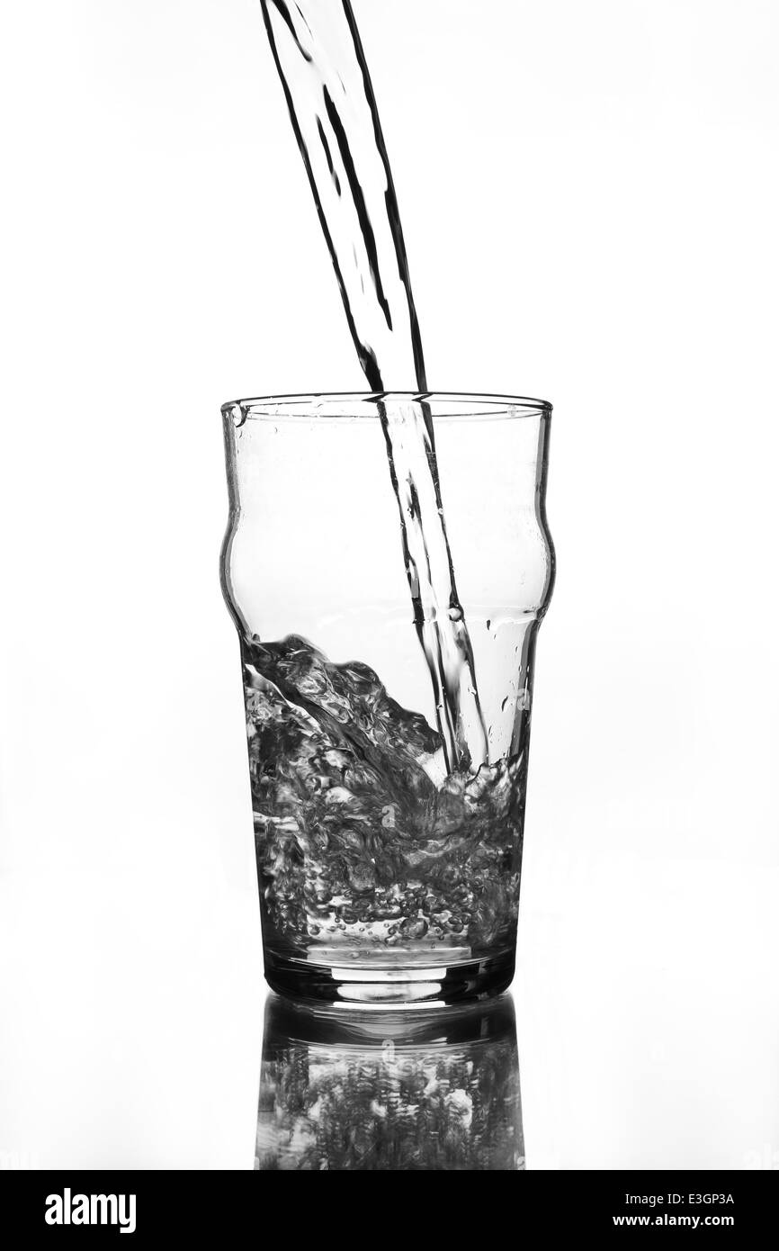 wine glass with water pouring (gray scale Stock Photo Alamy
