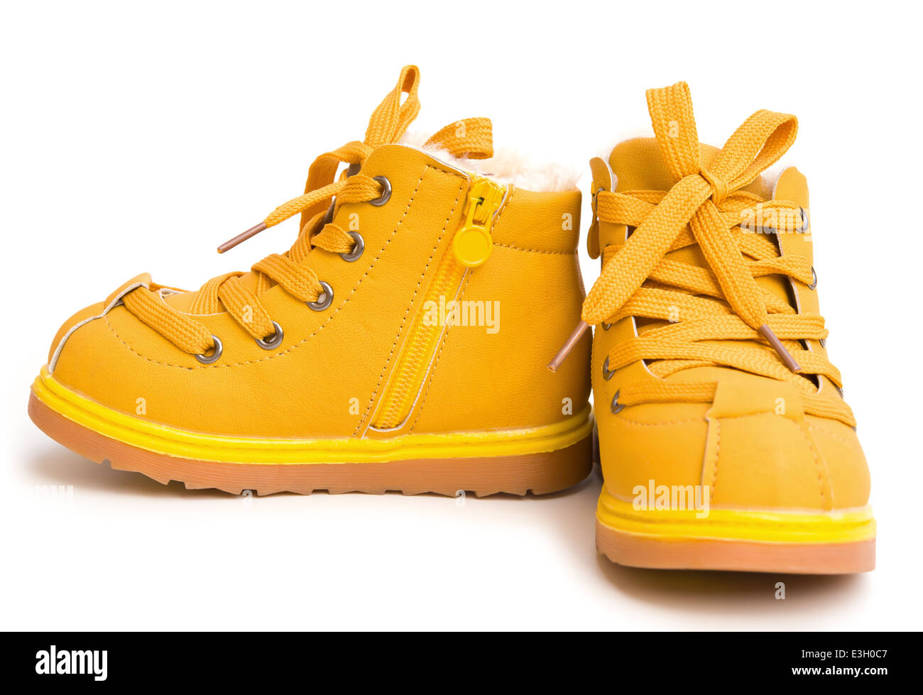 pair of orange shoes for kid on white background Stock Photo Alamy