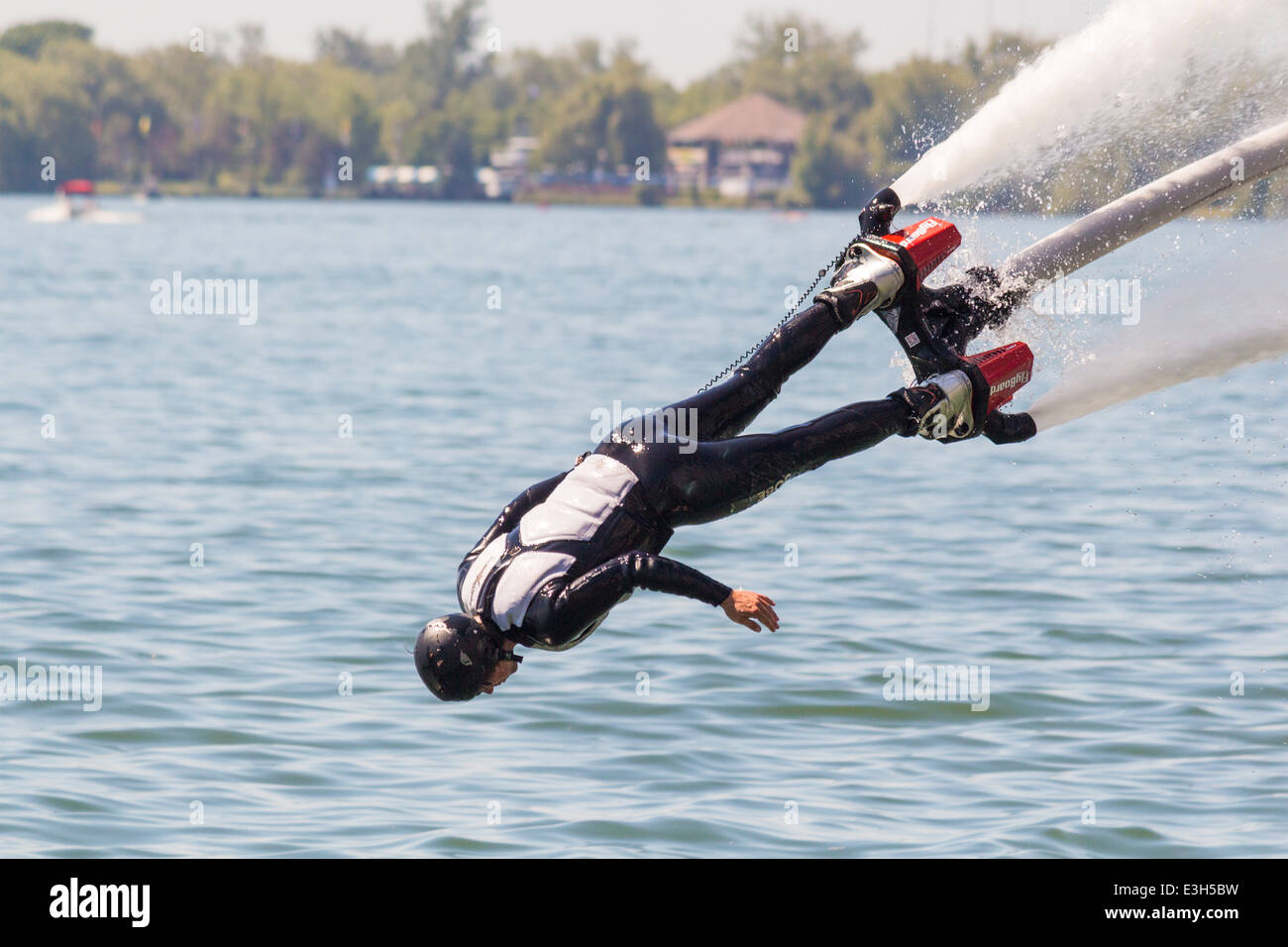 Male Flyboarder Doing The Dolphin At The North American Flyboard male-flyboarder-doing-the-dolphin-at-the-north-american-flyboard