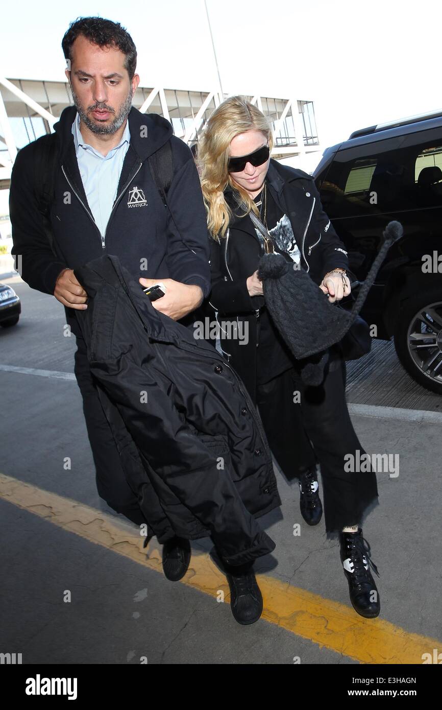 Madonna at LAX for a departing flight  Featuring: Madonna Where: Los Angeles, California, United States When: 18 Nov 2013 Stock Photo