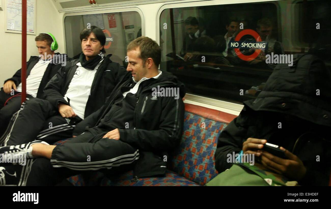 Germany football team head coach Joachim Low and colleagues seen travelling on a London Underground tube train ahead of the friendly international football match between England and Germany at Wembley tonight (19Nov13)  Featuring: Joachim Loew,Joachim Low Stock Photo