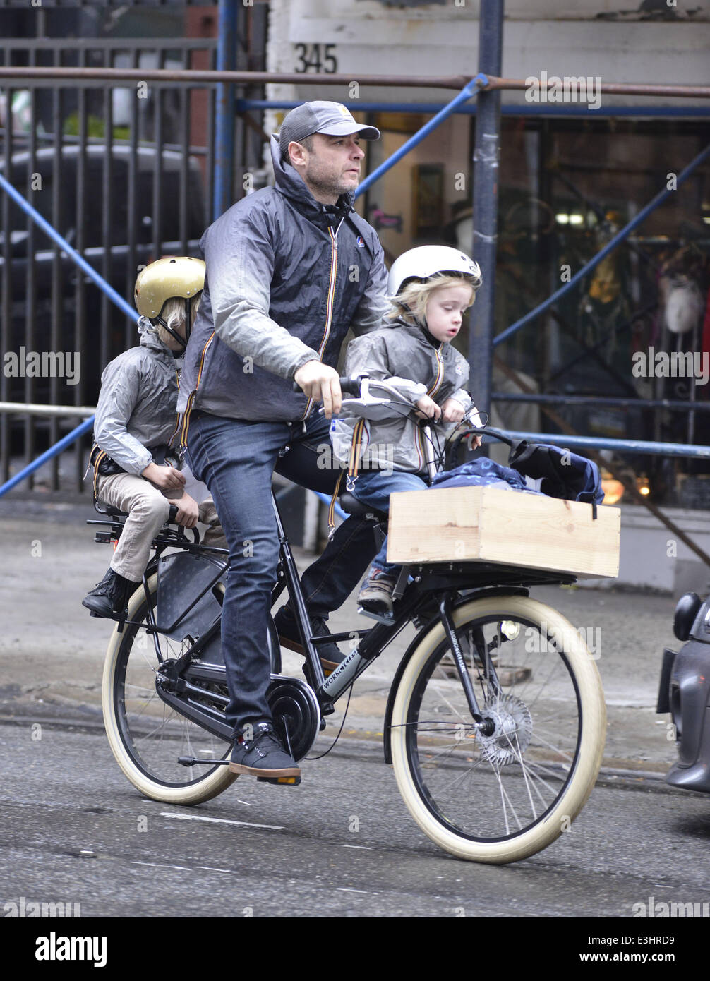 Liev Schreiber Takes His Sons To School Giving Them A Ride On His Bike Originally Wearing The Same Black Puffa Coat The Trio Then Change Into Matching Grey K Way Rain Jackets Featuring Liev Schreiber Takes His Sons To School Giving Them A Ride On His Bike Originally Wearing The Same Black Puffa Coat The Trio Then Change Into Matching Grey K Way Rain Jackets Featuring