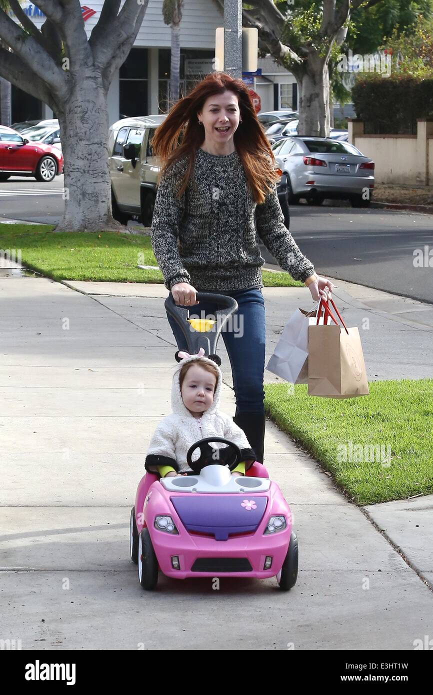 Alyson Hannigan takes daughter Satyana out shopping in a toy mini car