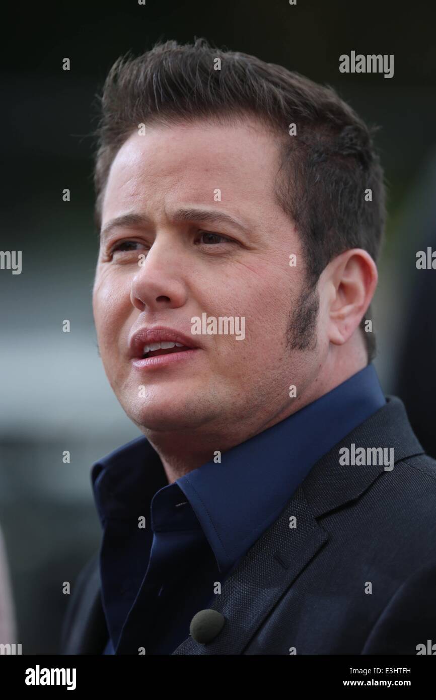 Chaz Bono appears on 'Extra' at Universal CityWalk and shows off his