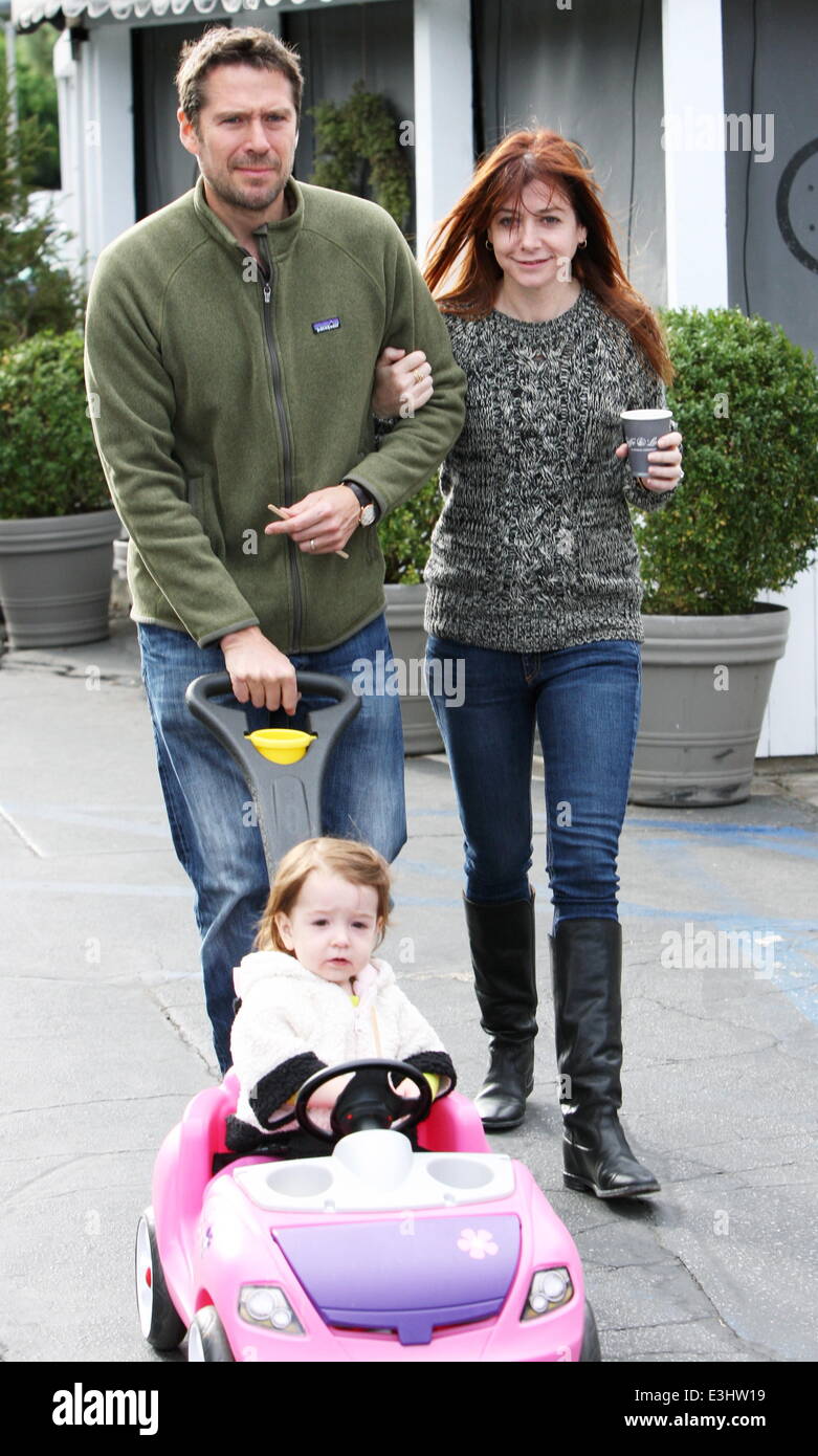 Alyson Hannigan and husband Alexis Denisof push their daughter Keeva in a  toy car whilst out shopping Featuring: Alyson Hannigan,Alexis Denisof,Keeva  Jane Denisof Where: Los Angeles, California, United States When: 22 Nov