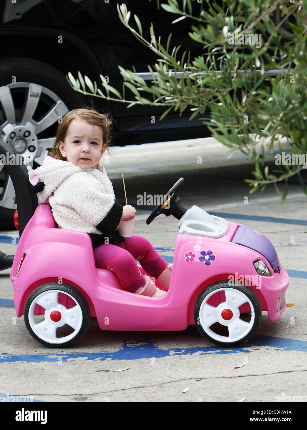 Alyson Hannigan and husband Alexis Denisof push their daughter Keeva in