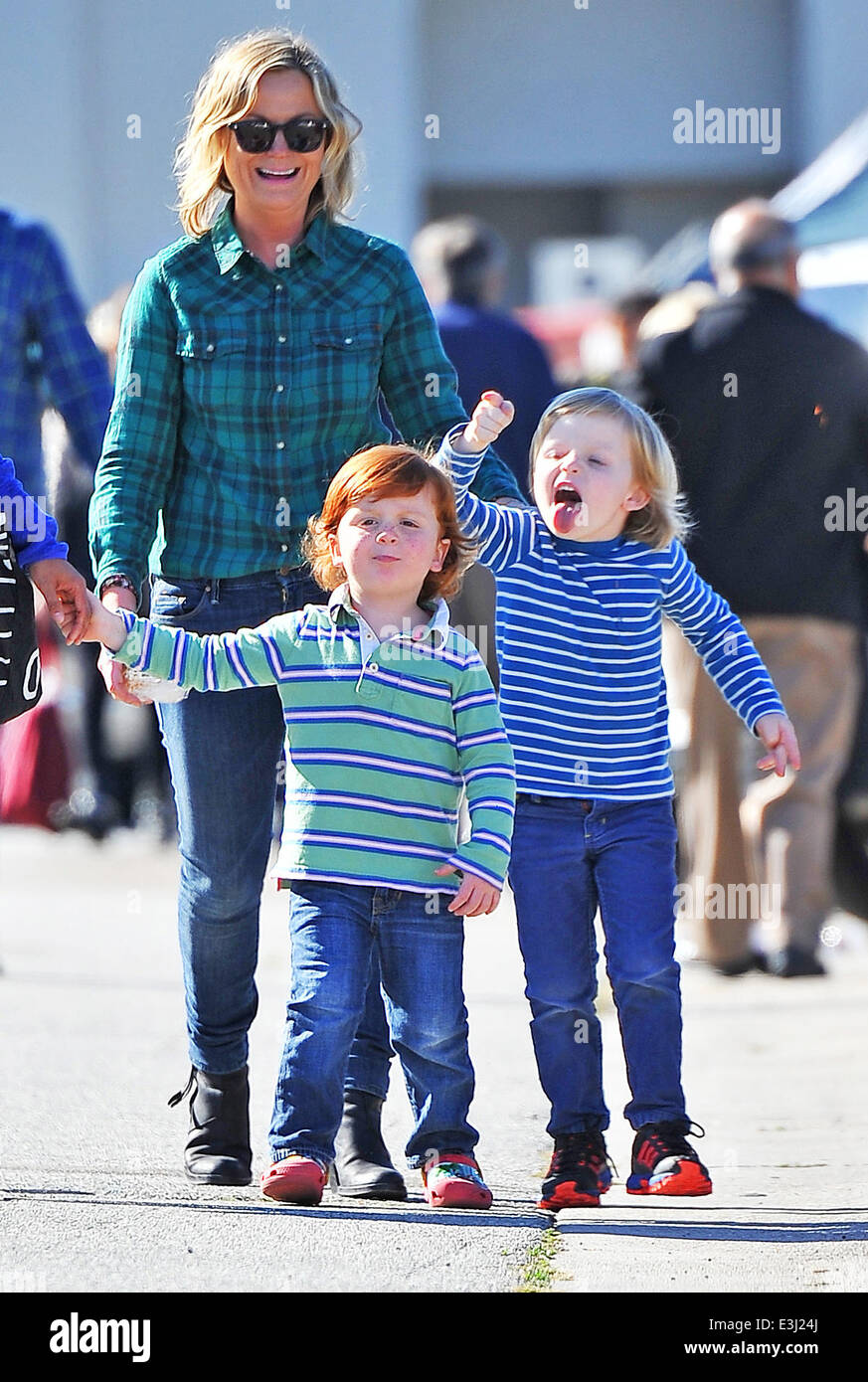 Amy Poehler takes her children Archie and Abel Arnett to a local Farmer