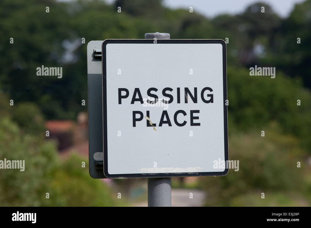 Rural Road Sign 'PASSING PLACE'. Norfolk. East Anglia. England. UK. Placed alongside section of purposely widened narrow road. Stock Photo
