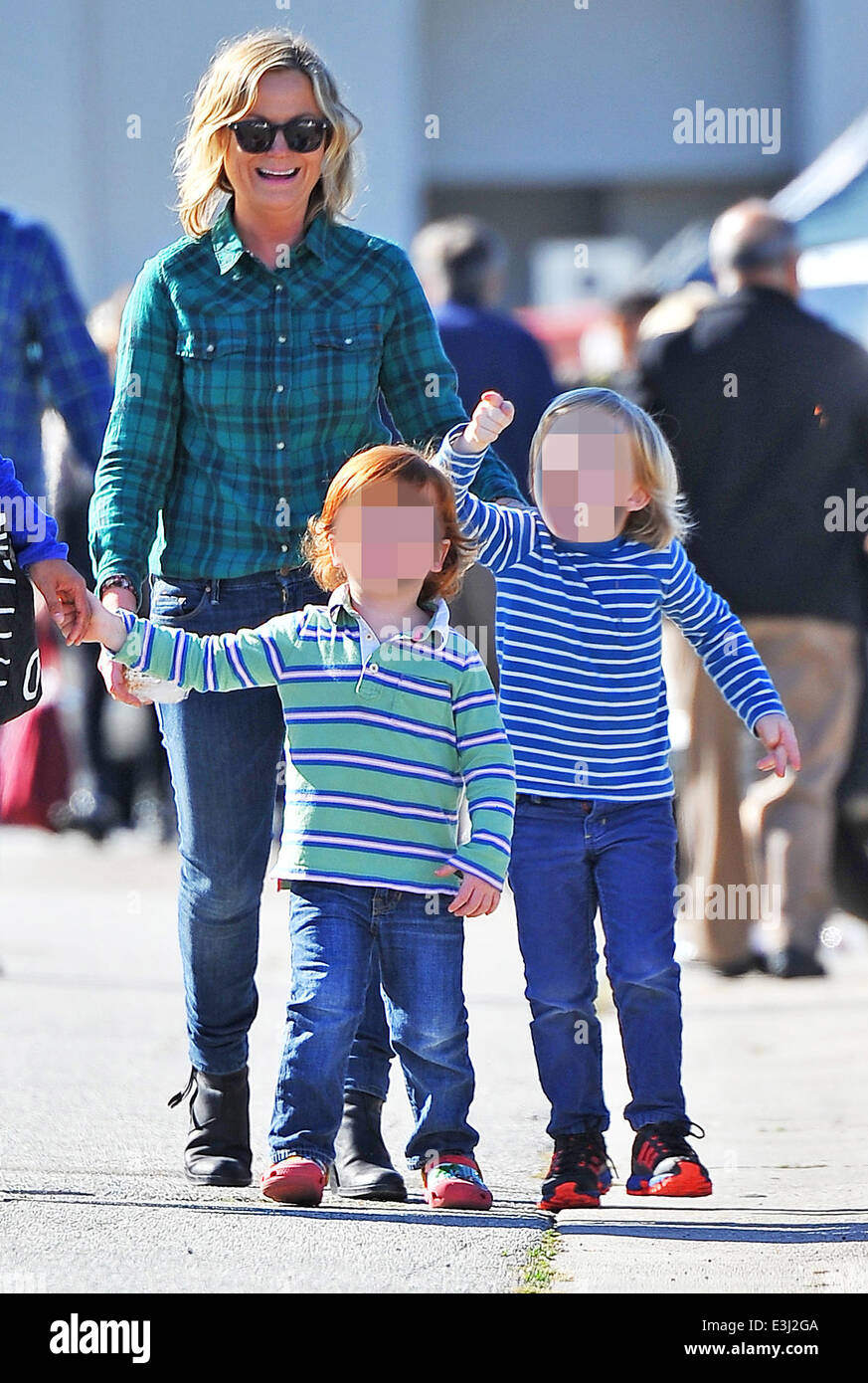 Amy Poehler takes her children Archie and Abel Arnett to a local Farmer