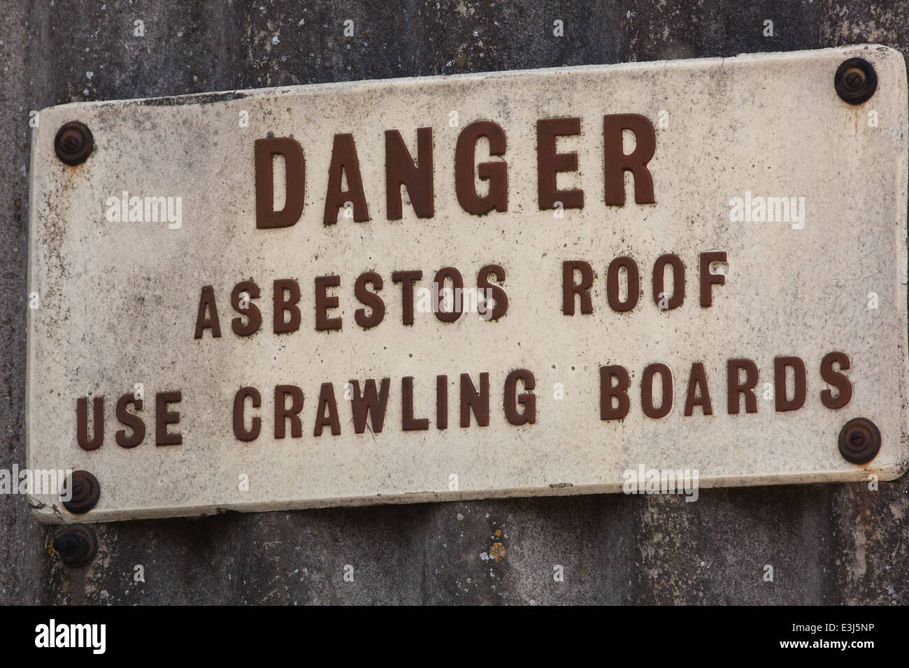 Asbestos Warning. Sign on light industrial building. Norwich. Norfolk. UK . Stock Photo