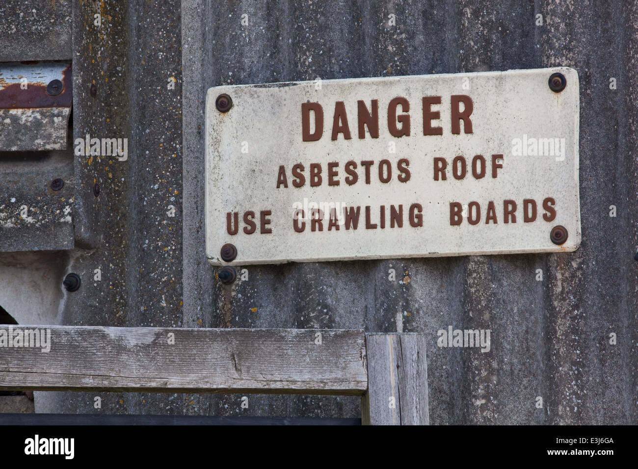 Asbestos Warning. Sign on light industrial building. Norwich. Norfolk. UK . Stock Photo
