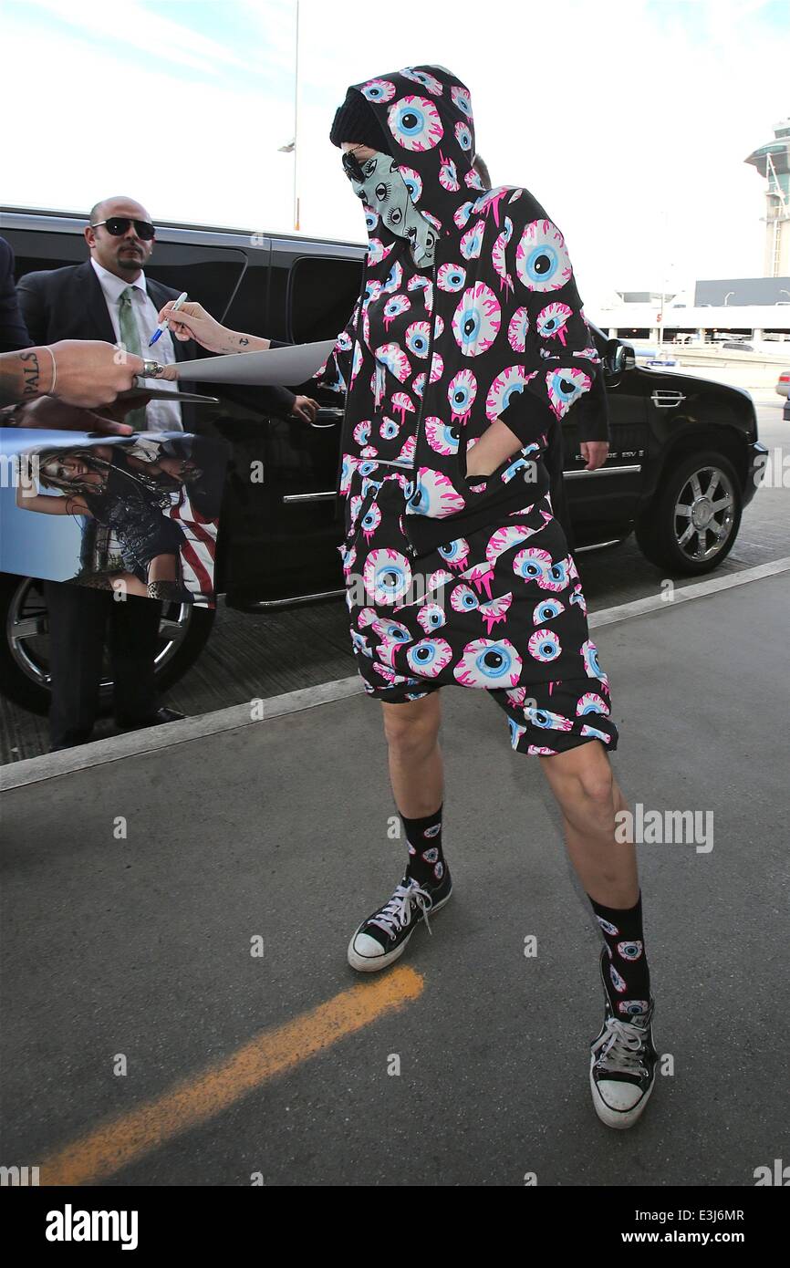 Kesha leaves for a trip at LAX airport dressed in eyes all over her outfit Featuring Kesha Where Los Angeles California United States When 26 Nov 2013 Stock Photo Alamy